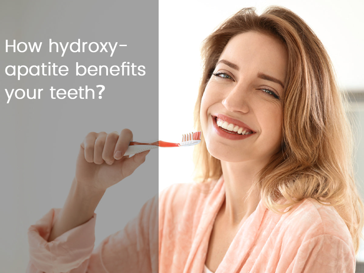 Smiling woman holding toothbrush, highlighting hydroxyapatite benefits for teeth