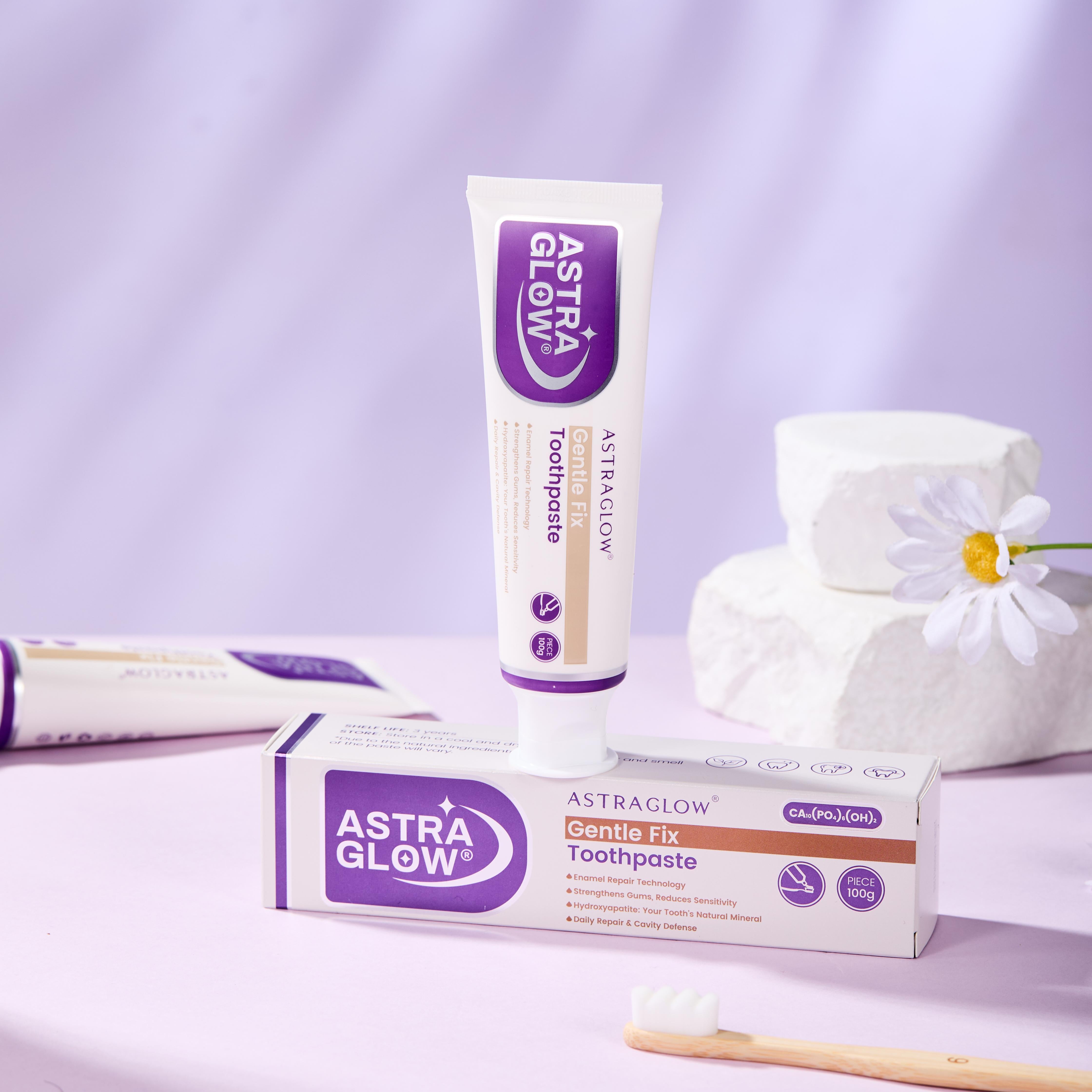 AstraGlow Gentle Fix Toothpaste tube and box on pastel surface with daisy and toothbrush
