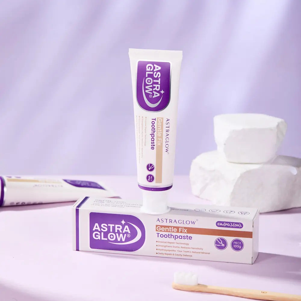 AstraGlow Gentle Fix Toothpaste with enamel repair tech, 100g tube and box, purple design, toothbrush nearby